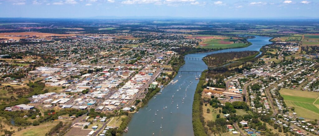 arial view of a river with buildings in the surrounds