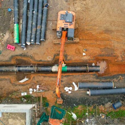 Aerial view of job site showing pipe in trench