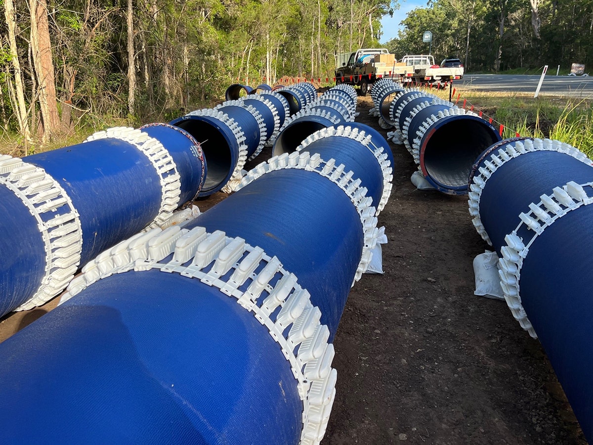 Lengths of Ductile Iron site next sitting end to end on site.
