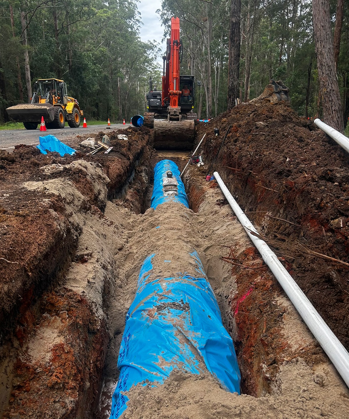 Ductile Iron pipe in excavated trench.