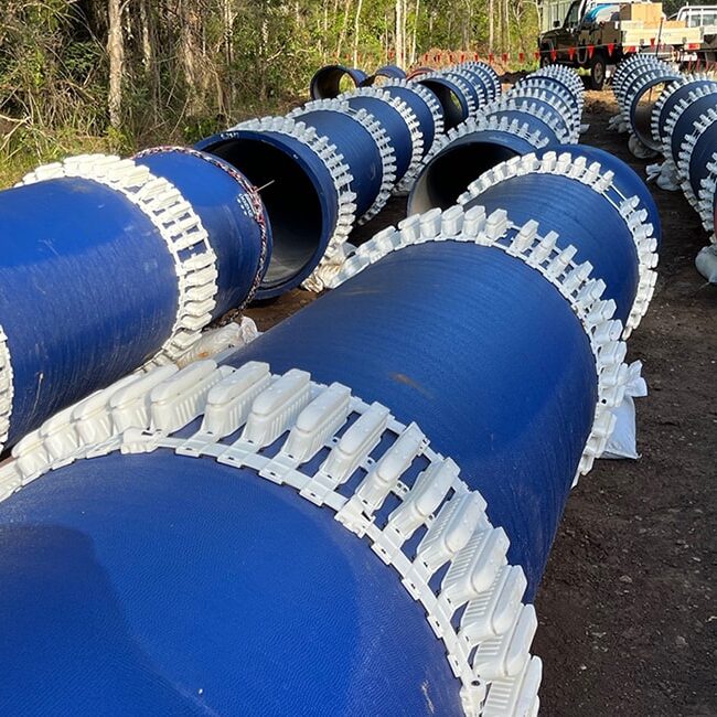 Lengths of Ductile Iron site next sitting end to end on site.