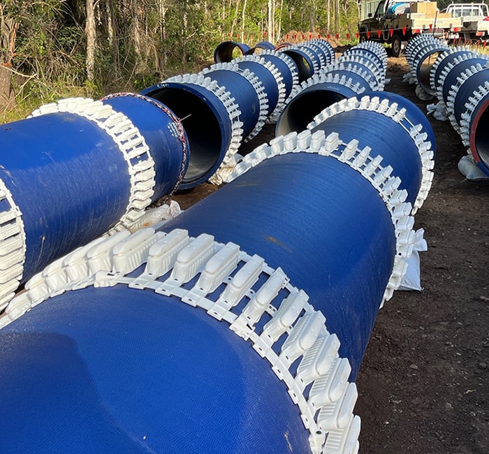 Lengths of Ductile Iron site next sitting end to end on site.